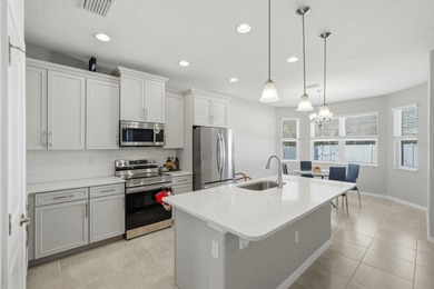 Welcome to this beautifully crafted 2023 SeaGate Homes residence on The Grand Club Cypress Course in Florida - for sale on GolfHomes.com, golf home, golf lot
