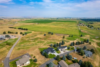 Welcome home to this three bedroom property in Ronan located on on Mission Mountain Country Club in Montana - for sale on GolfHomes.com, golf home, golf lot