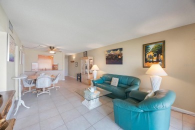 Experience Waterfront Living in this Charming 2-Bed, 2-Bath on Isla Del Sol Yacht and Country Club in Florida - for sale on GolfHomes.com, golf home, golf lot
