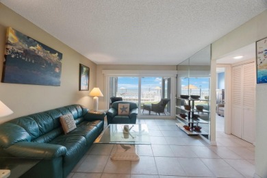 Experience Waterfront Living in this Charming 2-Bed, 2-Bath on Isla Del Sol Yacht and Country Club in Florida - for sale on GolfHomes.com, golf home, golf lot