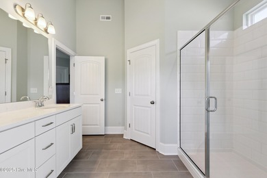 Situated on the 16th green of the Beau Rivage Golf Course, this on Beau Rivage Golf and Resort in North Carolina - for sale on GolfHomes.com, golf home, golf lot