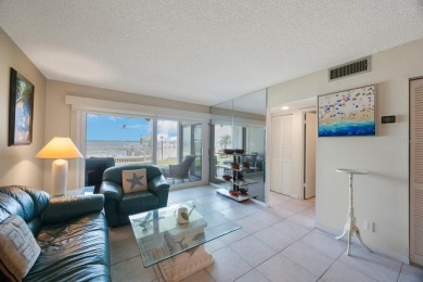 Experience Waterfront Living in this Charming 2-Bed, 2-Bath on Isla Del Sol Yacht and Country Club in Florida - for sale on GolfHomes.com, golf home, golf lot