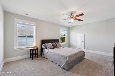 Situated on the 16th green of the Beau Rivage Golf Course, this on Beau Rivage Golf and Resort in North Carolina - for sale on GolfHomes.com, golf home, golf lot