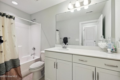 Situated on the 16th green of the Beau Rivage Golf Course, this on Beau Rivage Golf and Resort in North Carolina - for sale on GolfHomes.com, golf home, golf lot