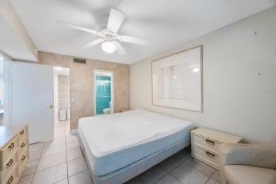 Experience Waterfront Living in this Charming 2-Bed, 2-Bath on Isla Del Sol Yacht and Country Club in Florida - for sale on GolfHomes.com, golf home, golf lot