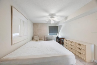 Experience Waterfront Living in this Charming 2-Bed, 2-Bath on Isla Del Sol Yacht and Country Club in Florida - for sale on GolfHomes.com, golf home, golf lot