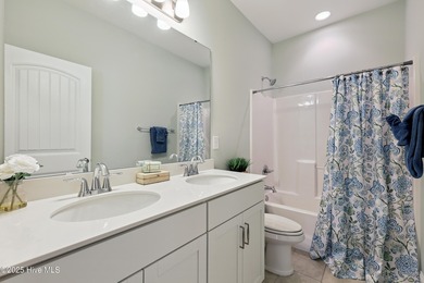 Situated on the 16th green of the Beau Rivage Golf Course, this on Beau Rivage Golf and Resort in North Carolina - for sale on GolfHomes.com, golf home, golf lot