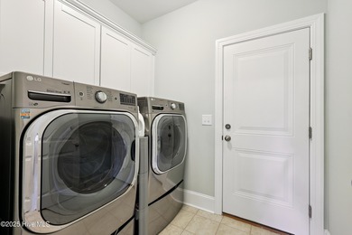 Situated on the 16th green of the Beau Rivage Golf Course, this on Beau Rivage Golf and Resort in North Carolina - for sale on GolfHomes.com, golf home, golf lot