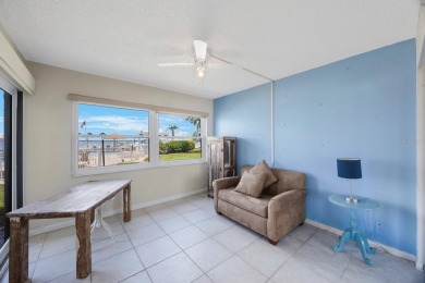 Experience Waterfront Living in this Charming 2-Bed, 2-Bath on Isla Del Sol Yacht and Country Club in Florida - for sale on GolfHomes.com, golf home, golf lot