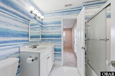 6005 S North Shore Ct sits in the Village at Nags Head, a on Nags Head Golf Links in North Carolina - for sale on GolfHomes.com, golf home, golf lot