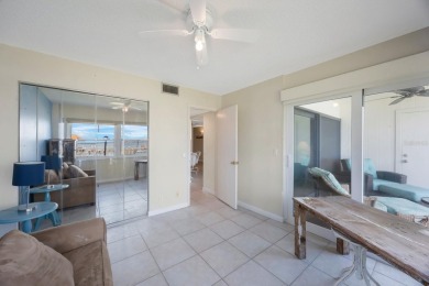 Experience Waterfront Living in this Charming 2-Bed, 2-Bath on Isla Del Sol Yacht and Country Club in Florida - for sale on GolfHomes.com, golf home, golf lot