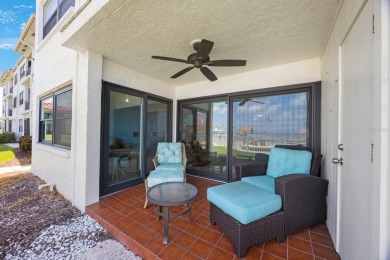 Experience Waterfront Living in this Charming 2-Bed, 2-Bath on Isla Del Sol Yacht and Country Club in Florida - for sale on GolfHomes.com, golf home, golf lot
