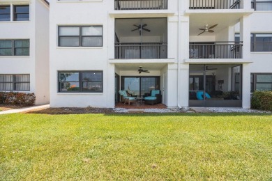 Experience Waterfront Living in this Charming 2-Bed, 2-Bath on Isla Del Sol Yacht and Country Club in Florida - for sale on GolfHomes.com, golf home, golf lot