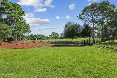 Situated on the 16th green of the Beau Rivage Golf Course, this on Beau Rivage Golf and Resort in North Carolina - for sale on GolfHomes.com, golf home, golf lot
