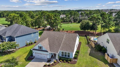 Situated on the 16th green of the Beau Rivage Golf Course, this on Beau Rivage Golf and Resort in North Carolina - for sale on GolfHomes.com, golf home, golf lot
