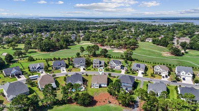 Situated on the 16th green of the Beau Rivage Golf Course, this on Beau Rivage Golf and Resort in North Carolina - for sale on GolfHomes.com, golf home, golf lot