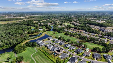 Situated on the 16th green of the Beau Rivage Golf Course, this on Beau Rivage Golf and Resort in North Carolina - for sale on GolfHomes.com, golf home, golf lot
