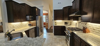 Discover the epitome of upscale living in this meticulously on Tellico Village -The Links At Kahite Golf Course in Tennessee - for sale on GolfHomes.com, golf home, golf lot