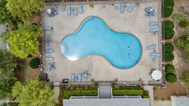 Situated on the 16th green of the Beau Rivage Golf Course, this on Beau Rivage Golf and Resort in North Carolina - for sale on GolfHomes.com, golf home, golf lot