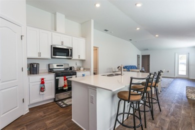 Welcome to this charming 4-bedroom, 2-bathroom home, built in on Grand Reserve Golf Course in Florida - for sale on GolfHomes.com, golf home, golf lot