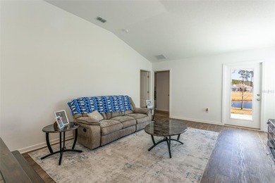 Welcome to this charming 4-bedroom, 2-bathroom home, built in on Grand Reserve Golf Course in Florida - for sale on GolfHomes.com, golf home, golf lot