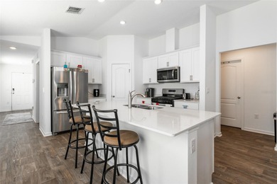 Welcome to this charming 4-bedroom, 2-bathroom home, built in on Grand Reserve Golf Course in Florida - for sale on GolfHomes.com, golf home, golf lot