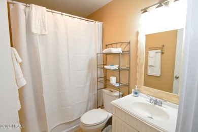 Beautifully located home is just a short golf cart ride from all on Ocean Point Golf Links in South Carolina - for sale on GolfHomes.com, golf home, golf lot