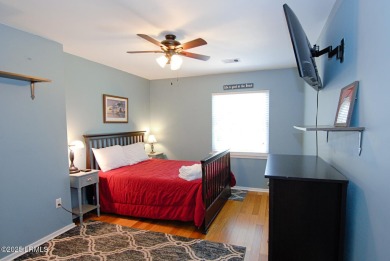 Beautifully located home is just a short golf cart ride from all on Ocean Point Golf Links in South Carolina - for sale on GolfHomes.com, golf home, golf lot