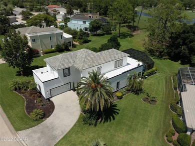Stunning contemporary architecture frames the wide open interior on Plantation Bay Golf and Country Club in Florida - for sale on GolfHomes.com, golf home, golf lot