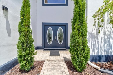Stunning contemporary architecture frames the wide open interior on Plantation Bay Golf and Country Club in Florida - for sale on GolfHomes.com, golf home, golf lot