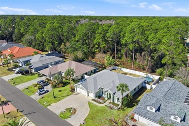 Beautifully updated 4BR/3BA custom home with a 3-car garage on The Grand Club - Pine Lakes Course in Florida - for sale on GolfHomes.com, golf home, golf lot