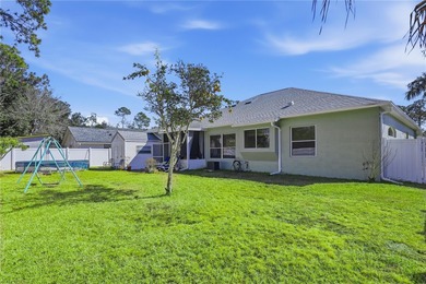 Beautifully updated 4BR/3BA custom home with a 3-car garage on The Grand Club - Pine Lakes Course in Florida - for sale on GolfHomes.com, golf home, golf lot