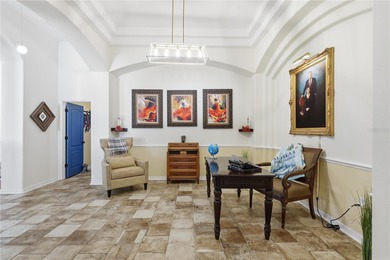 Beautifully updated 4BR/3BA custom home with a 3-car garage on The Grand Club - Pine Lakes Course in Florida - for sale on GolfHomes.com, golf home, golf lot