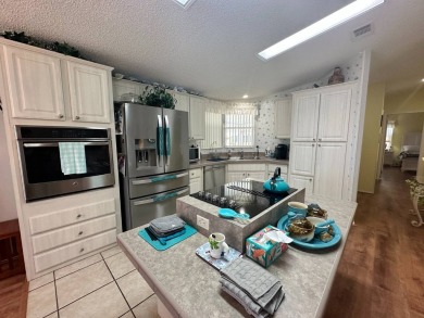 FULLY FURNISHED RETREAT ON 9th FAIRWAY! 2000 Homes of Merit  Lot on Four Lakes Golf Club in Florida - for sale on GolfHomes.com, golf home, golf lot