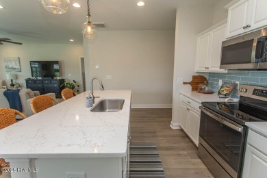 Upgrades galore in this beautiful 4BR/2BA home in the quaint on Ocean Ridge Plantation in North Carolina - for sale on GolfHomes.com, golf home, golf lot