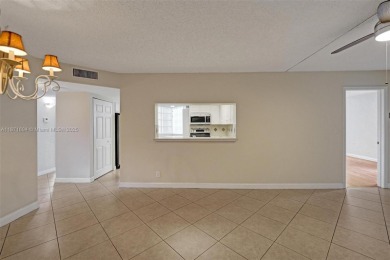 Spacious and bright 3-bedroom corner unit located on the second on Pine Island Ridge Country Club in Florida - for sale on GolfHomes.com, golf home, golf lot