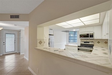 Spacious and bright 3-bedroom corner unit located on the second on Pine Island Ridge Country Club in Florida - for sale on GolfHomes.com, golf home, golf lot