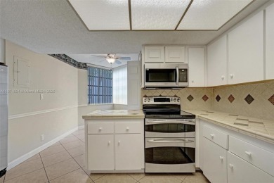 Spacious and bright 3-bedroom corner unit located on the second on Pine Island Ridge Country Club in Florida - for sale on GolfHomes.com, golf home, golf lot