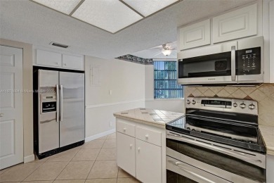Spacious and bright 3-bedroom corner unit located on the second on Pine Island Ridge Country Club in Florida - for sale on GolfHomes.com, golf home, golf lot