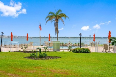 LUXURY WATERFRONT LIVING--DESIGNER FINISHES, POOL, SUNSET AND on Isla Del Sol Yacht and Country Club in Florida - for sale on GolfHomes.com, golf home, golf lot