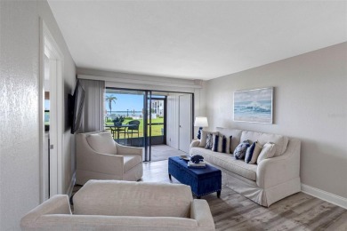 LUXURY WATERFRONT LIVING--DESIGNER FINISHES, POOL, SUNSET AND on Isla Del Sol Yacht and Country Club in Florida - for sale on GolfHomes.com, golf home, golf lot