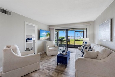 LUXURY WATERFRONT LIVING--DESIGNER FINISHES, POOL, SUNSET AND on Isla Del Sol Yacht and Country Club in Florida - for sale on GolfHomes.com, golf home, golf lot