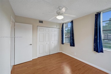 Spacious and bright 3-bedroom corner unit located on the second on Pine Island Ridge Country Club in Florida - for sale on GolfHomes.com, golf home, golf lot