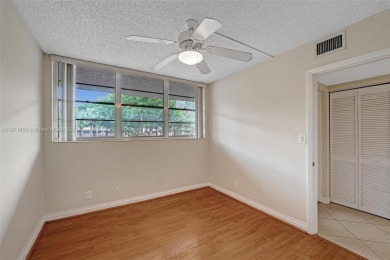 Spacious and bright 3-bedroom corner unit located on the second on Pine Island Ridge Country Club in Florida - for sale on GolfHomes.com, golf home, golf lot