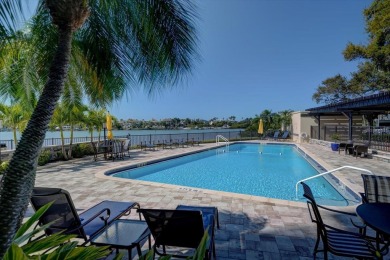 Tucked behind the private, guarded gates of the prestigious on Belleair Country Club in Florida - for sale on GolfHomes.com, golf home, golf lot