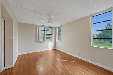 Spacious and bright 3-bedroom corner unit located on the second on Pine Island Ridge Country Club in Florida - for sale on GolfHomes.com, golf home, golf lot