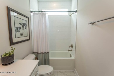 Upgrades galore in this beautiful 4BR/2BA home in the quaint on Ocean Ridge Plantation in North Carolina - for sale on GolfHomes.com, golf home, golf lot