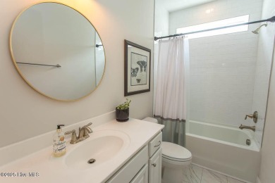 Upgrades galore in this beautiful 4BR/2BA home in the quaint on Ocean Ridge Plantation in North Carolina - for sale on GolfHomes.com, golf home, golf lot