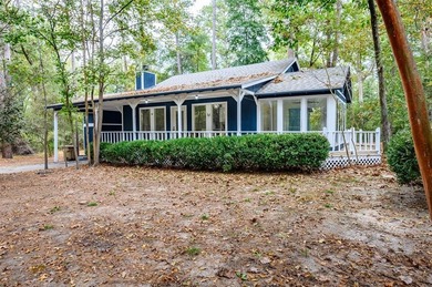 Nestled in a serene, wooded interior lot, this beautifully on Holly Lake Ranch Golf Club in Texas - for sale on GolfHomes.com, golf home, golf lot