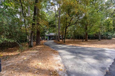 Nestled in a serene, wooded interior lot, this beautifully on Holly Lake Ranch Golf Club in Texas - for sale on GolfHomes.com, golf home, golf lot